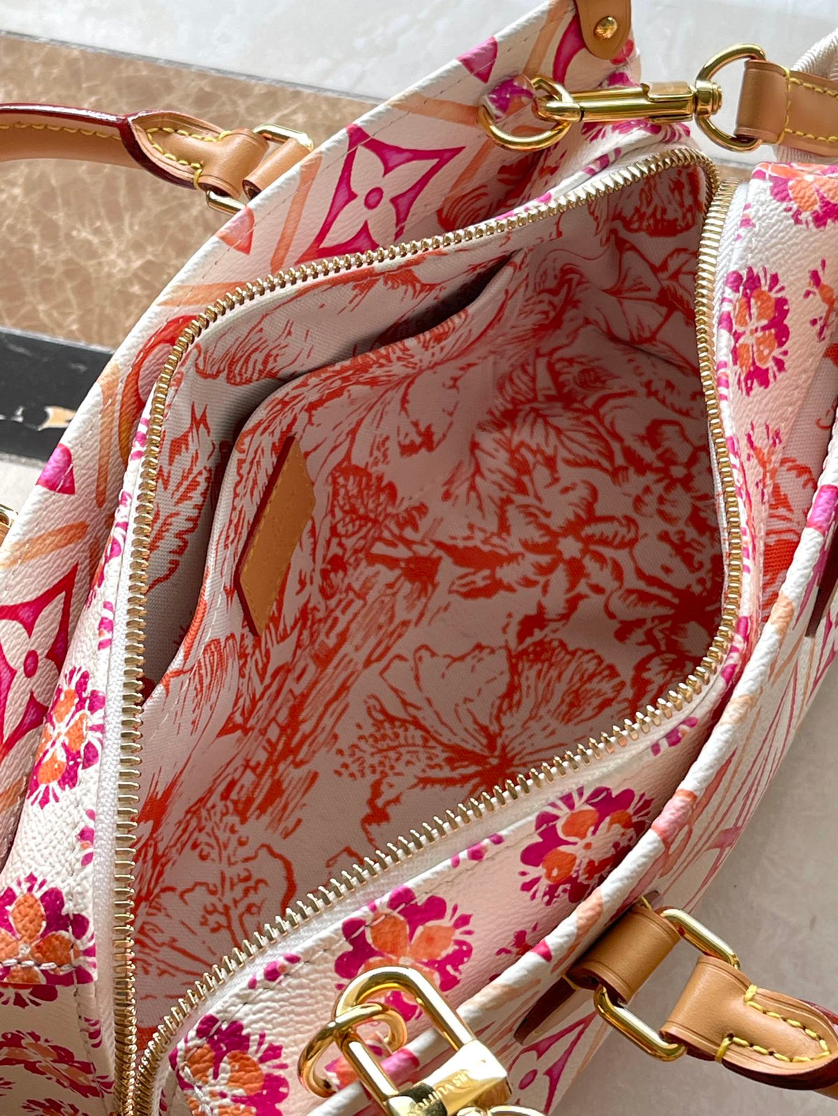 Onthego East West 25 in Coral Monogram Tiles Canvas