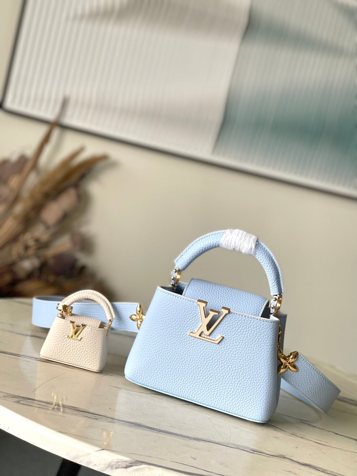 Capucines Mini 21 in Candy Blue Taurillon Gold Hardware