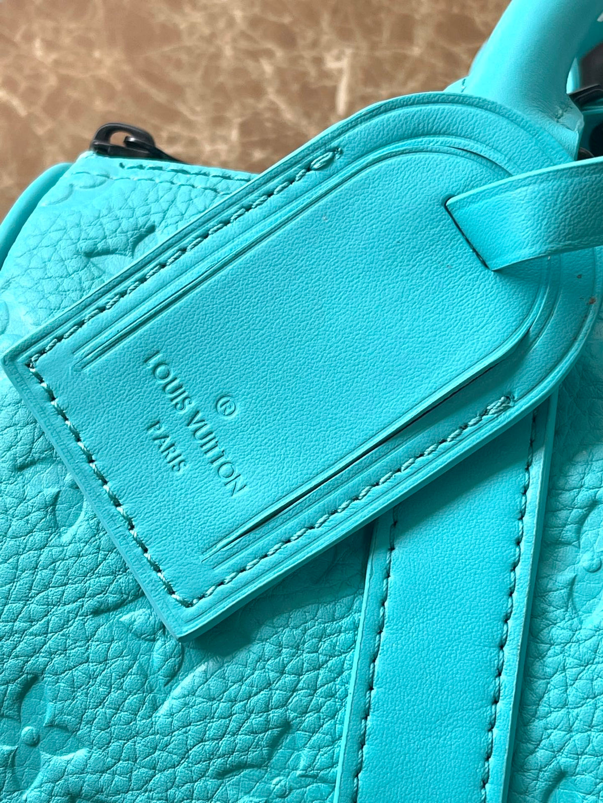 Keepall Bandoulière 25 in Turquoise Blue Monogram Embossed Calfskin