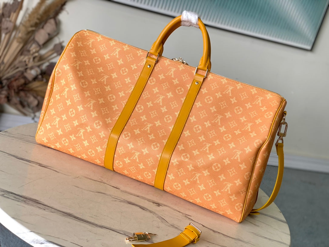 Keepall Bandoulière 55 in Orange Monogram Heritage Canvas