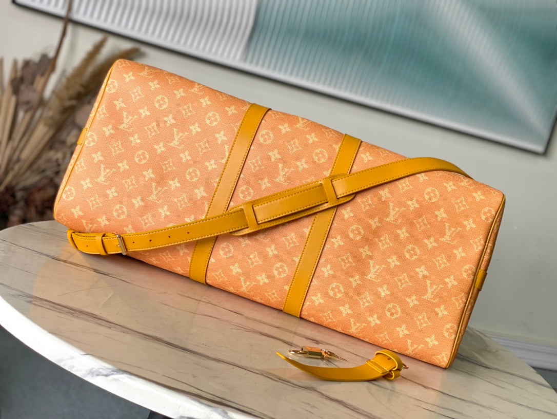 Keepall Bandoulière 55 in Orange Monogram Heritage Canvas