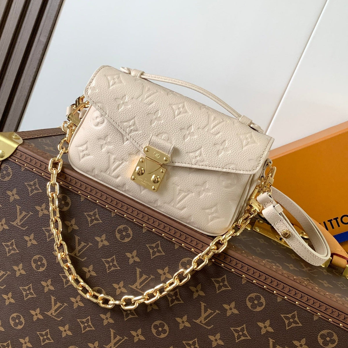 Pochette Métis East West 22 in Light Beige Monogram Empreinte Calfskin Embossed